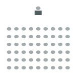 Auditorium room setup with table at front of the room